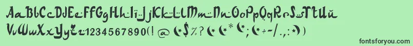 Шрифт Arabdancesmediumitalic – чёрные шрифты на зелёном фоне