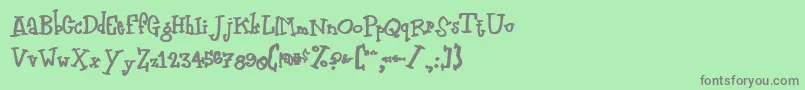 フォントZodiasti – 緑の背景に灰色の文字