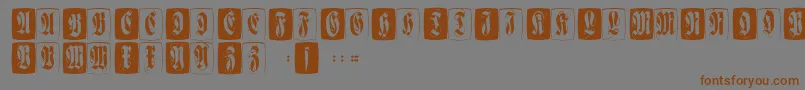 Flourishffcaps-Schriftart – Braune Schriften auf grauem Hintergrund