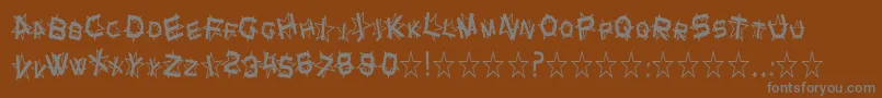 SfStarDustCondensed-fontti – harmaat kirjasimet ruskealla taustalla