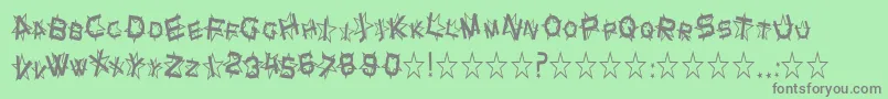 SfStarDustCondensed-fontti – harmaat kirjasimet vihreällä taustalla
