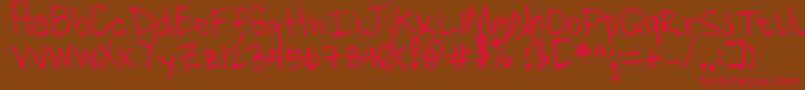 フォントTenMillionFireflies – 赤い文字が茶色の背景にあります。