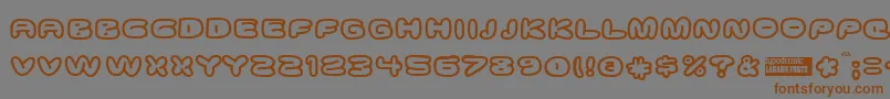 Ghostmea Font – Brown Fonts on Gray Background