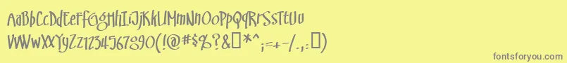 フォントSwingsetBb – 黄色の背景に灰色の文字