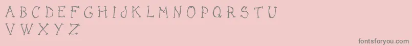 フォントDarkPlaceDemo – ピンクの背景に灰色の文字