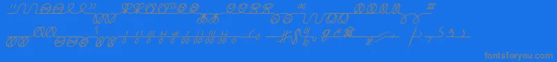 NumukkiI-fontti – harmaat kirjasimet sinisellä taustalla