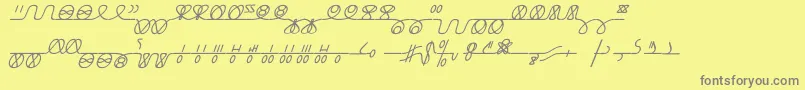 NumukkiI-fontti – harmaat kirjasimet keltaisella taustalla