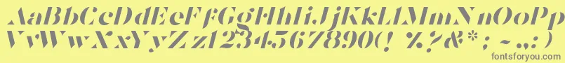 TostadaItalic-Schriftart – Graue Schriften auf gelbem Hintergrund