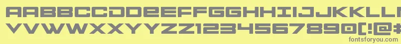 フォントMontrocexpand – 黄色の背景に灰色の文字