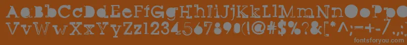 Sqseriftwo-Schriftart – Graue Schriften auf braunem Hintergrund