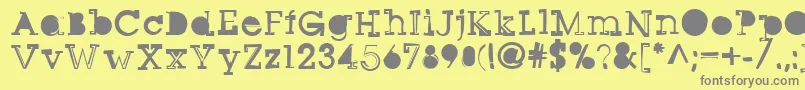 フォントSqseriftwo – 黄色の背景に灰色の文字