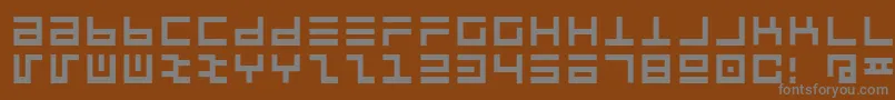 Pclintrulla-fontti – harmaat kirjasimet ruskealla taustalla