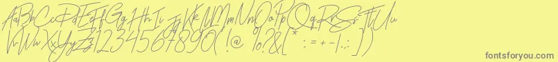 Rhesmanisa Font – Gray Fonts on Yellow Background