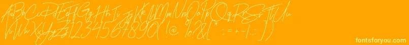 Rhesmanisa Font – Yellow Fonts on Orange Background