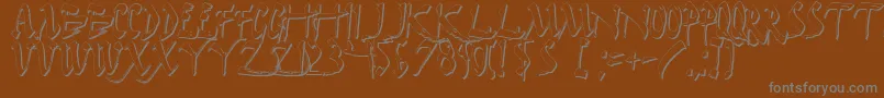 Darkhs-fontti – harmaat kirjasimet ruskealla taustalla