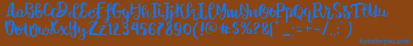 ChelseaBrushScript Font – Blue Fonts on Brown Background