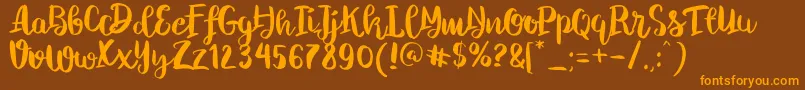 ChelseaBrushScript Font – Orange Fonts on Brown Background