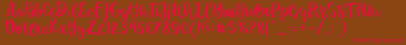 ChelseaBrushScript Font – Red Fonts on Brown Background