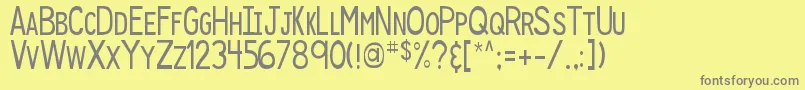 DjbSpeakUp-fontti – harmaat kirjasimet keltaisella taustalla
