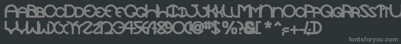 フォントTocopillascapssskBold – 黒い背景に灰色の文字