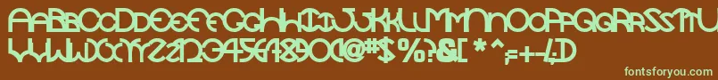 フォントTocopillascapssskBold – 緑色の文字が茶色の背景にあります。