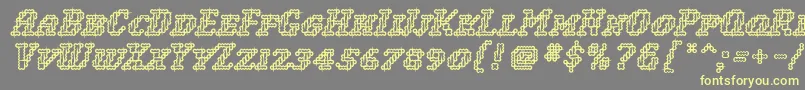 WoollyInline-Schriftart – Gelbe Schriften auf grauem Hintergrund