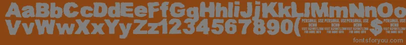Więcej informacji o czcionce MuddytractordemoKcfonts Czcionka MuddytractordemoKcfonts – szare czcionki na brązowym tle