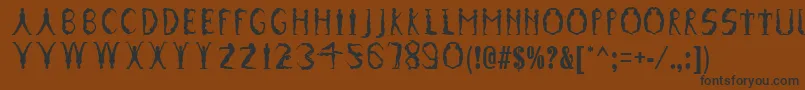 GymnasticsRegular Font – Black Fonts on Brown Background