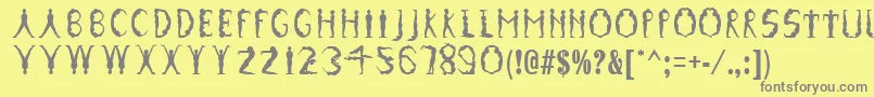 GymnasticsRegular-Schriftart – Graue Schriften auf gelbem Hintergrund