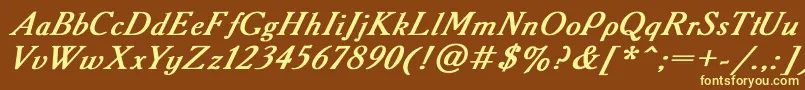 AAdemyItalicBoldItalic-fontti – keltaiset fontit ruskealla taustalla
