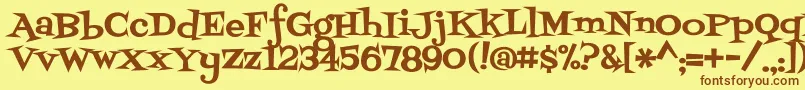 フォントFontdinerswanky – 茶色の文字が黄色の背景にあります。