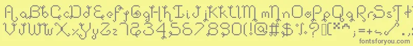 Dollpixellowzz-fontti – harmaat kirjasimet keltaisella taustalla