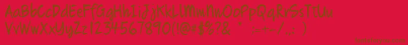 Quikhand Font – Brown Fonts on Red Background