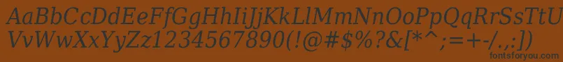 フォントDejavuserifcondensedItalic – 黒い文字が茶色の背景にあります