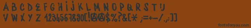 フォントWaterbaseCre – 黒い文字が茶色の背景にあります