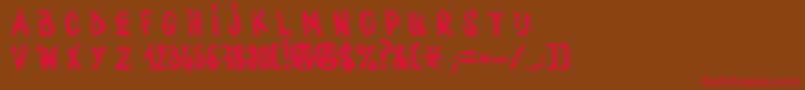 フォントWaterbaseCre – 赤い文字が茶色の背景にあります。