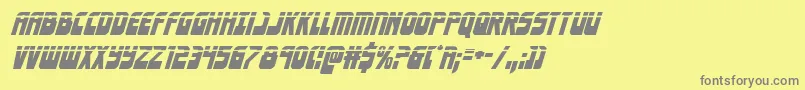 Eldebaranlaserital-fontti – harmaat kirjasimet keltaisella taustalla