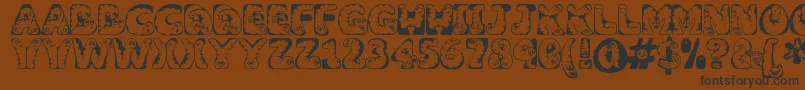 Wiggles ffy-Schriftart – Schwarze Schriften auf braunem Hintergrund