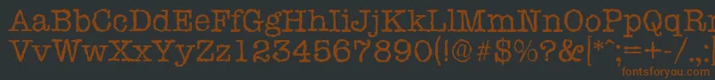 Шрифт TypewriterrandomRegular – коричневые шрифты на чёрном фоне