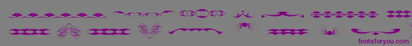 フォントTribalismFree – 紫色のフォント、灰色の背景