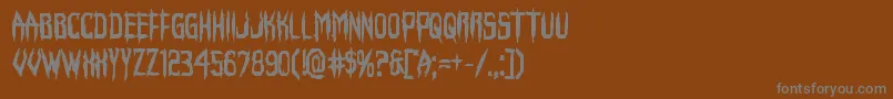 Horroroidbold-fontti – harmaat kirjasimet ruskealla taustalla