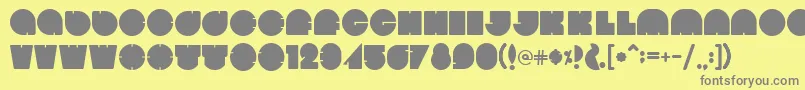 フォントBola – 黄色の背景に灰色の文字
