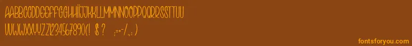 SpeakEasy Font – Orange Fonts on Brown Background