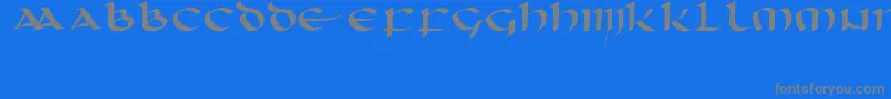 フォントUnciaal – 青い背景に灰色の文字