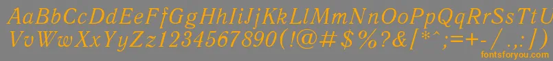 フォントAntiqua1 – オレンジの文字は灰色の背景にあります。