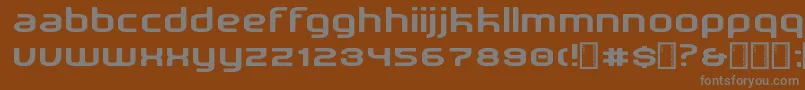 NewDetroit-fontti – harmaat kirjasimet ruskealla taustalla