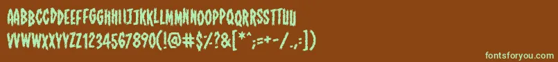 フォントShallowgravebb – 緑色の文字が茶色の背景にあります。