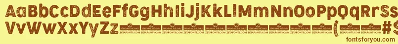 Czcionka CocogooseNarrowLetterpressTrial – brązowe czcionki na żółtym tle