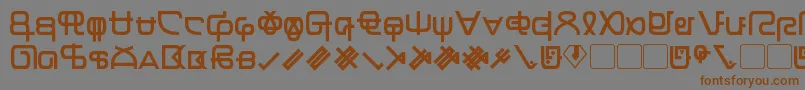 フォントZentran – 茶色の文字が灰色の背景にあります。