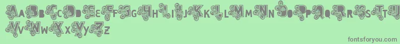 Шрифт Vtks Caps Loco – серые шрифты на зелёном фоне